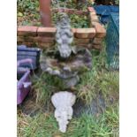 A RECONSTITUTED STONE CHERUB BIRD BATH AND A CHERUB WALL SCONCE