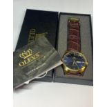 AN AS NEW AND BOXED OLEVS WRIST WATCH SEEN WORKING BUT NO WARRANTY