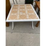 A METAL FRAMED COFFEE TABLE WITH TILED TOP - 26" X 30"