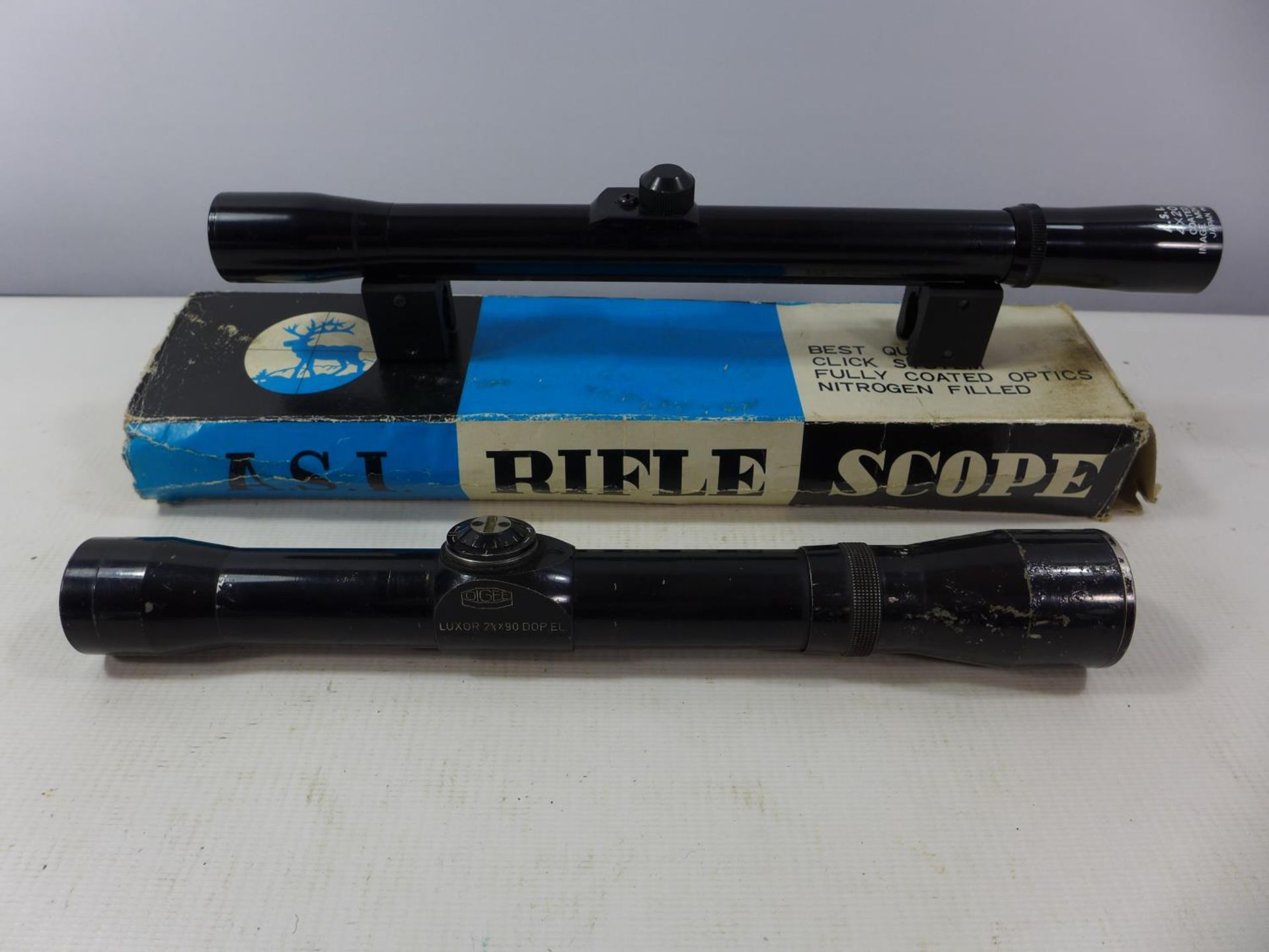 A BOXED A.S.I. 4 X 20 TELESCOPIC SIGHT AND A OIGEE LUXOR 2 3/4 X 90 SIGHT (2)