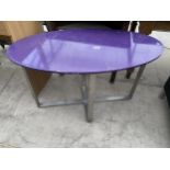 A MODERN OVAL OCCASIONAL TABLE ON STEEL FRAME