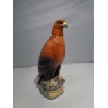 A CERAMIC BENEAGLES SCOTCH WHISKEY DECANTER IN THE DESIGN OF A GOLDEN EAGLE A/F