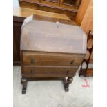 AN EARLY 20TH CENTURY SMALL OAK BUREAU, 29" WIDE