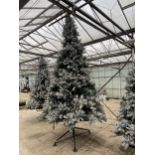 AN ARTIFICAL SNOW CHRISTMAS TREE ALL COMPLETE WITH STAND APPROXIMATELY 11FT TALL