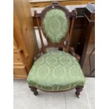 A VICTORIAN WALNUT NURSING CHAIR ON TURNED AND FLUTED FRONT LEGS