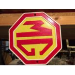 A ROUND CAST MG SIGN