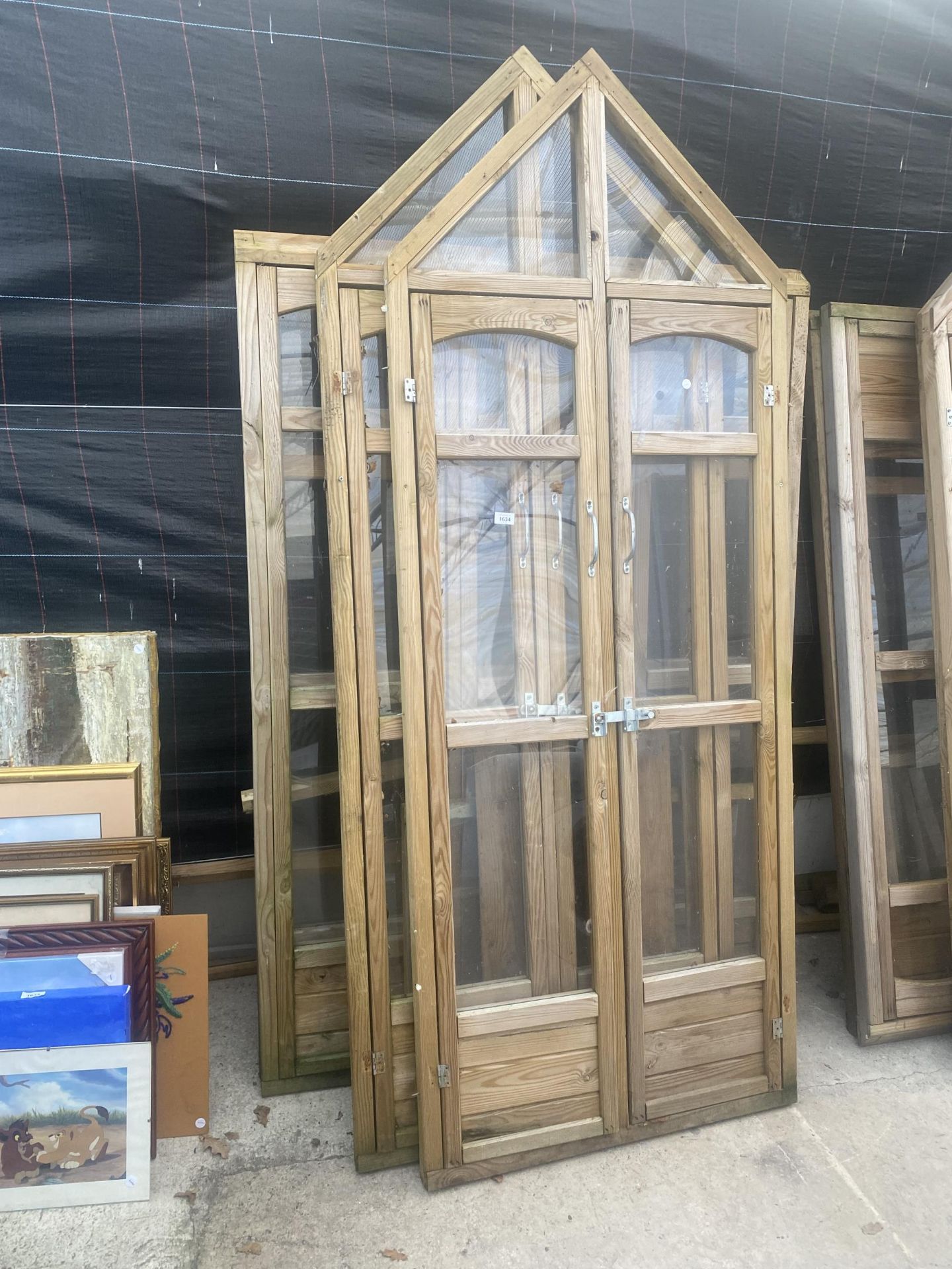 A WOODEN FRAMED GARDEN GREENHOUSE