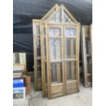 A WOODEN FRAMED GARDEN GREENHOUSE