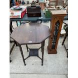 AN EDWARDIAN CENTRE TABLE AND HARDWOOD CD RACK