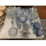 A LARGE AMOUNT OF BLUE COLOURED GLASSWARE TO INCLUDE LEAF SHAPED SERVING DISHES, BOWLS, GLASSES,