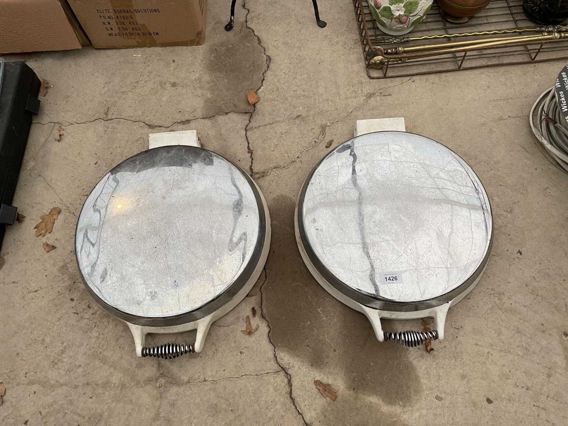 A PAIR OF WHITE AND STAINLESS STEEL ARGER COVERS