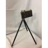 A VINTAGE KODAK CAMERA AND SMALL TRIPOD