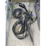 AN ASSORTMENT OF PRESSURE WASHER HOSES AND LANCES