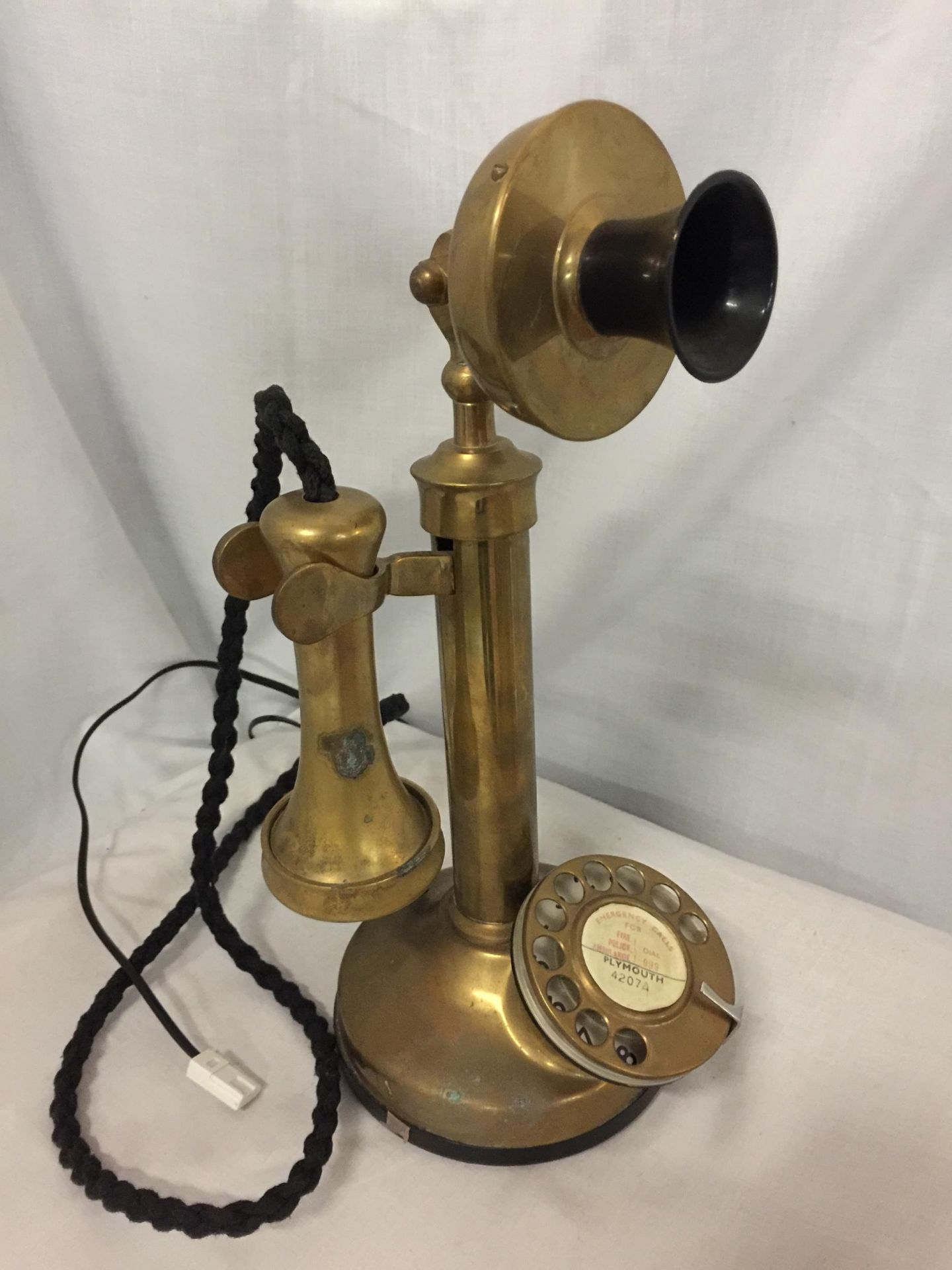 A BRASS CANDLESTICK TELEPHONE