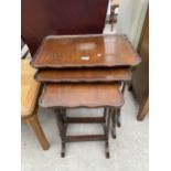 A NEST OF THREE MAHOGANY TABLES