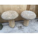 A PAIR OF STONE EFFECT SADDLE STONES