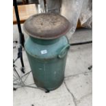 A VINTAGE CAST IRON 'NEWHALL DAIRIES' MILK CHURN WITH LID AND IN GOOD CONDITION FOR AGE