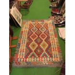 A 100% HAND KNOTTED CHOBI KILIM WOOLLEN RUG IN GREENS, CREAMS AND ORANGE. SIZE 147CM X 101CM