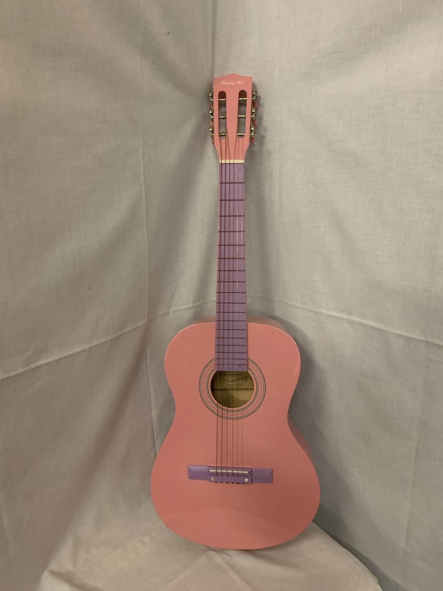 A PINK READY ACE ACCOUSTIC GUITAR