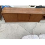 A RETRO TEAK SIDEBOARD, 70.5" WIDE, WITH THREE SLIDING DOORS