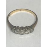 A MARKED 18 CT GOLD RING WITH FIVE GRADUATED IN LINE DIAMONDS SIZE P/Q GROSS WEIGHT 1.9 GRAMS