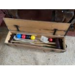 A CROQUET SET IN A WOODEN CASE