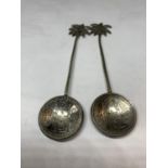 A PAIR OF TESTED SILVER SPOONS