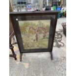 A MID 20TH CENTURY OAK TAPESTRY FIRE SCREEN