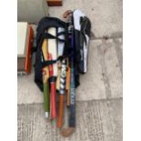 A BAG OF SPORTS EQUIPMENT - CRICKET BATS, HOCKEY STICKS ETC