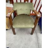 A MID 20TH CENTURY OAK FRAMED TUB TYPE CHAIR