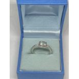 A SILVER 925 PANDORA RING WITH CLEAR STONE AND PRESENTATION BOX