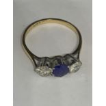 AN 18 CARAT GOLD RING WITH TWO DIAMONDS AND A SAPPHIRE SIZE J/K GROSS WEIGHT 1.8 GRAMS