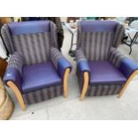 A PAIR OF WINGED EASY CHAIRS BY SHACKLETONS OF BANBURY