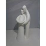 A ROYAL DOULTON 'FAMILY' ALL WHITE FIGURE