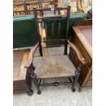 A GEORGIAN ELM LANCASHIRE ELBOW CHAIR WITH RUSH SEAT