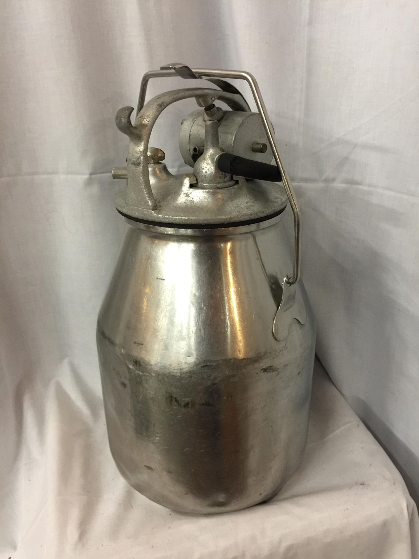 A VINTAGE MILK CHURN