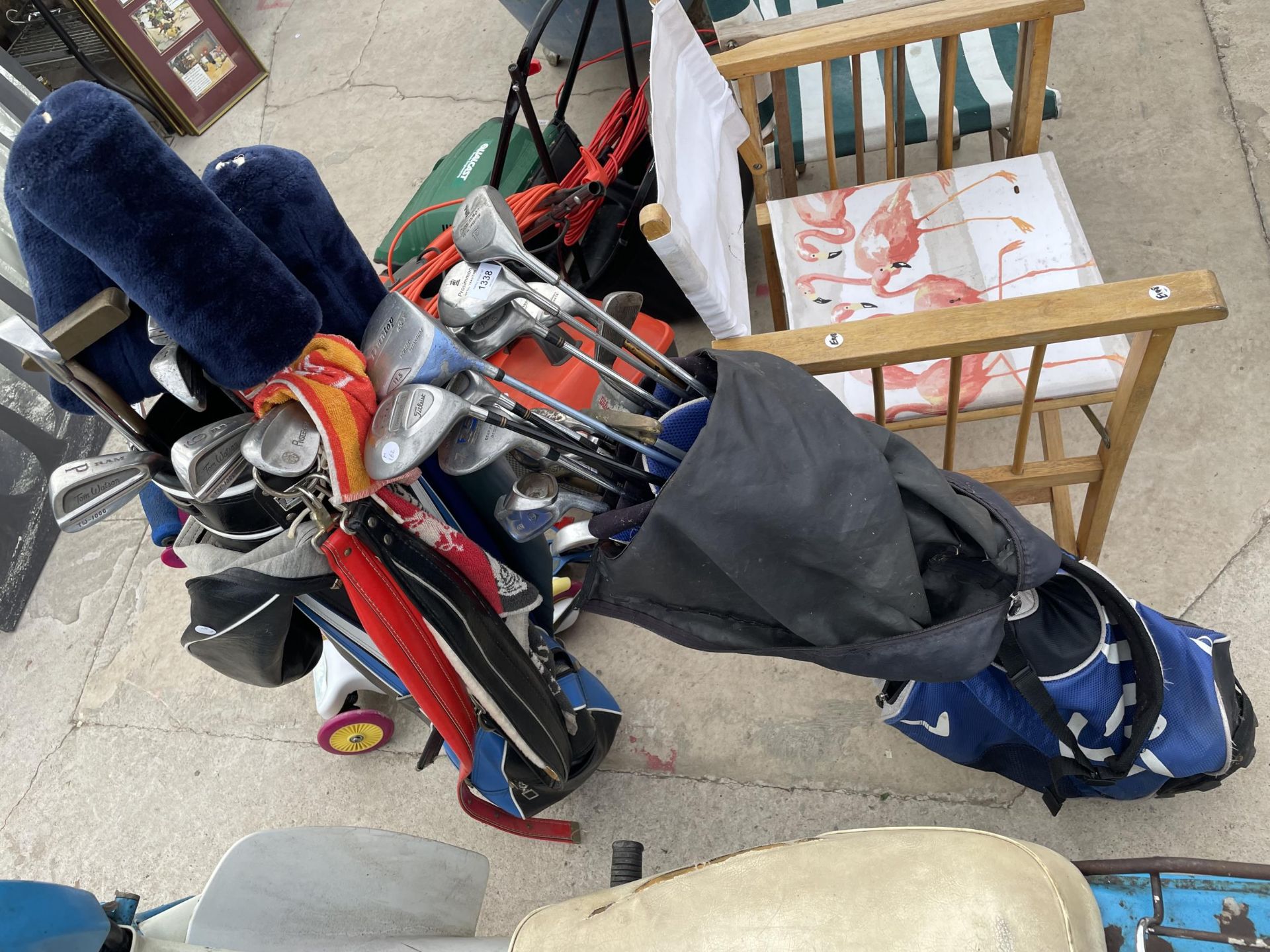 TWO GOLF BAGS CONTAINING VARIOUS GOLF CLUBS