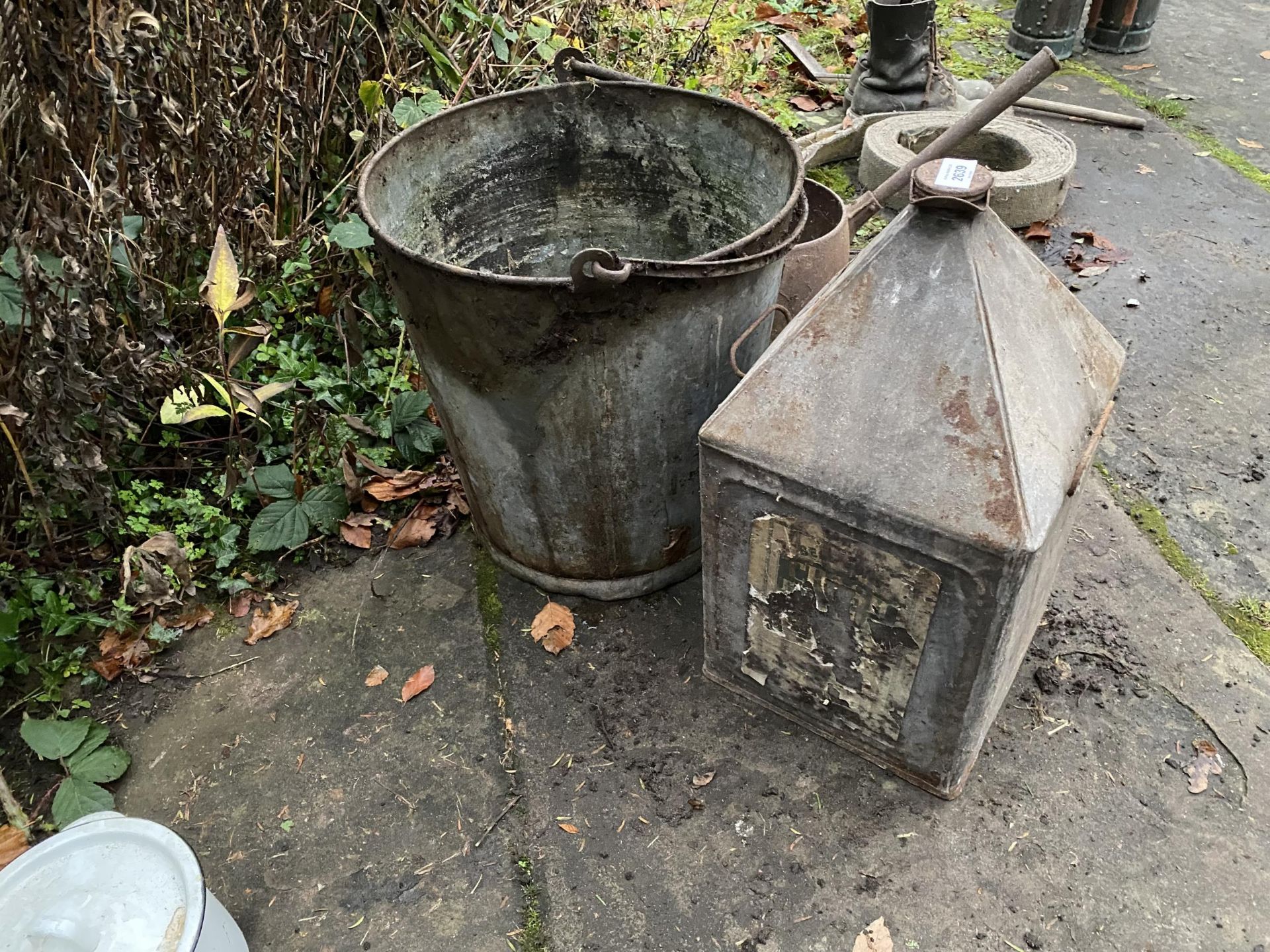 A LARGE VINTAGE FUEL DRUM AND A FURTHER GALVANISED BUCKET