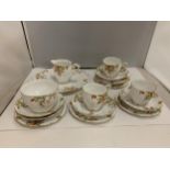 BELL CHINA CUPS, SAUCERS, PLATES, ETC IN A DELICATE ORANGE, YELLOW AND GREEN FLORAL PATTERN