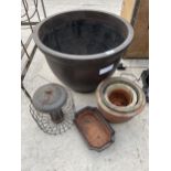 AN ASSORTMENT OF PLANTERS AND A BIRD FEEDER