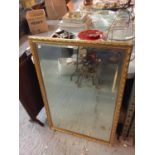 A GILT FRAMED MIRROR