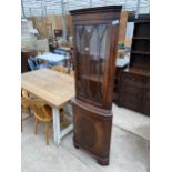 A MODERN MAHOGANY CORNER CUPBOARD