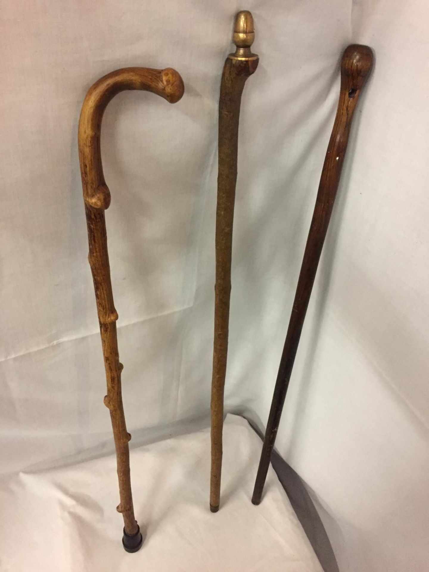 THREE WOODEN WALKING STICKS, ONE WITH DECORATIVE BRASS ACORN TOP - Image 2 of 4