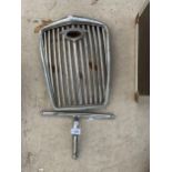 A VINTAGE STAINLESS STEEL CAR GRILL
