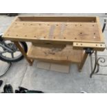 A WOODEN WORKBENCH WITH VICE