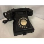 A VINTAGE BLACK 1950'S BAKELITE GPO ROTARY DIAL TELEPHONE WITH PULL OUT CARD TRAY