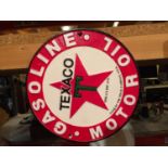 A ROUND CAST TEXACO MOTOR OIL SIGN