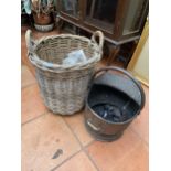 A WICKER LOG BASKET AND A COPPER COAL SCUTTLE