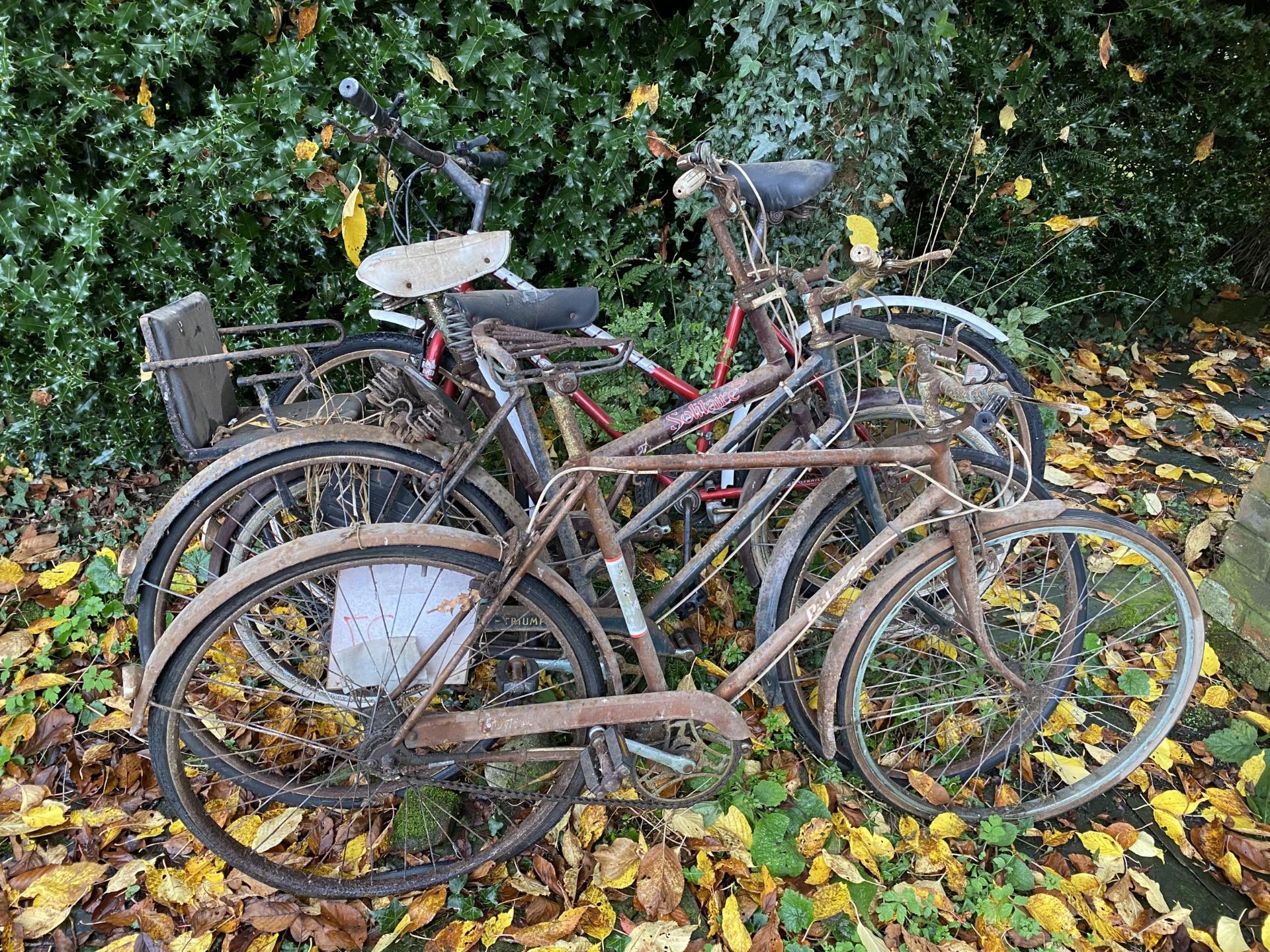 FOUR BIKES TO INCLUDE THREE VINTAGE TWO BEING RALEIGH AND A TRIUMPH