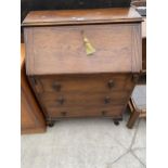 AN EARLY 20TH CENTURY OAK BUREAU